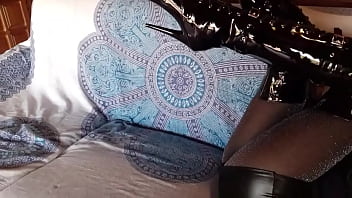 Total black with fishnets pantyhose and boots over the knee