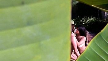 Two horny lesbos rub their pussies under the sun