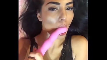 Brunette playing with dildo in mouth