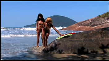 Young lesbians have sensual intercourse licking and toying their tight holes on the seaside