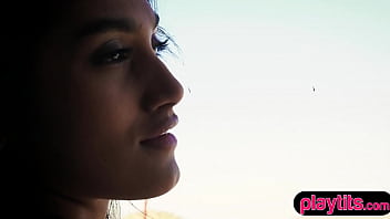 Cute brunette at a sky resort gives a striptease show for the camera