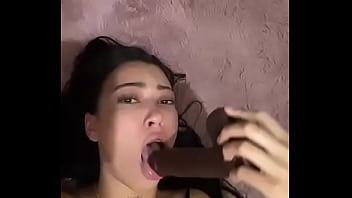 Latina teen deepthroats a thick dildo