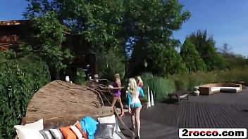 Slutty girlfriends get fucked outdoors by the lake