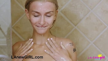 Beautiful blonde teen gently touch her body in the shower