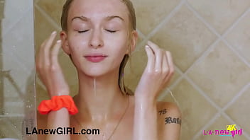Beautiful blonde teen gently touch her body in the shower