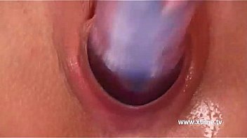 Hot teenager playing with a dildo