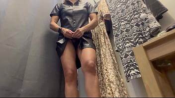 A sexy woman with big breasts and a big ass tries on clothes