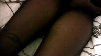 While dressed in black stockings i give him a footjob that ends with a bang