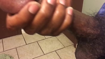 Young black guy jerks cock
