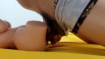 Young man with a big carrot fucking his sex doll my big cock