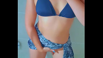 Sun kissed latina cutie cleans her body in a steamy post beach shower