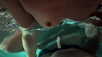 Babe in dress gets in the water to fuck