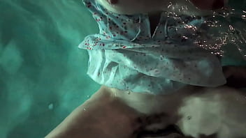 Babe in dress gets in the water to fuck