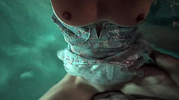 Babe in dress gets in the water to fuck