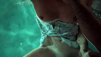 Babe in dress gets in the water to fuck