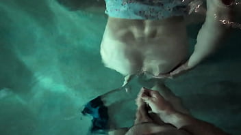 Babe in dress gets in the water to fuck