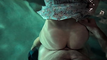 Babe in dress gets in the water to fuck