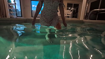 Babe in dress gets in the water to fuck