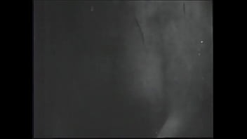 Long haired brunette posing for an erotic shoot