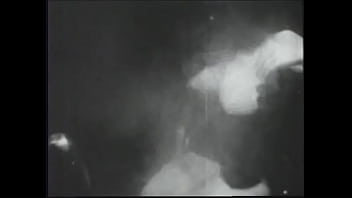 Long haired brunette posing for an erotic shoot