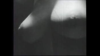 Long haired brunette posing for an erotic shoot