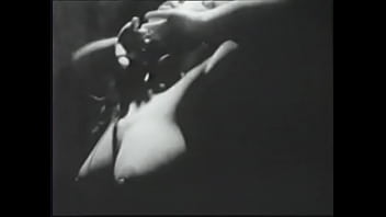 Long haired brunette posing for an erotic shoot