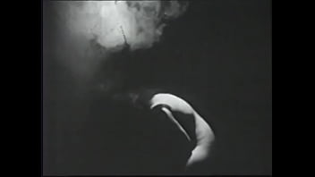 Long haired brunette posing for an erotic shoot