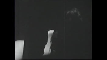 Long haired brunette posing for an erotic shoot