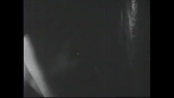 Long haired brunette posing for an erotic shoot