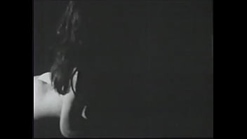 Long haired brunette posing for an erotic shoot