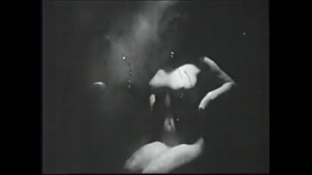 Long haired brunette posing for an erotic shoot