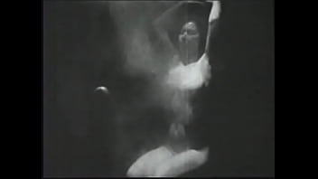 Long haired brunette posing for an erotic shoot