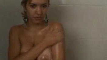 Happy hot blonde girl having fun in shower