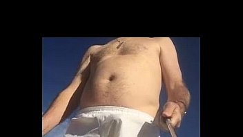 Guy In White Boxers With Stiffie On Beach thumbnail