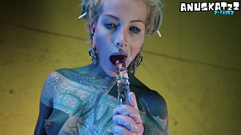 Sexy tattooed babe in latex stretching herself wide with her toys