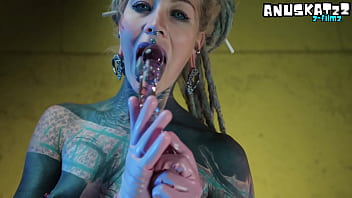 Sexy tattooed babe in latex stretching herself wide with her toys