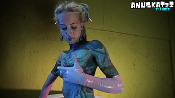 Sexy tattooed babe in latex stretching herself wide with her toys