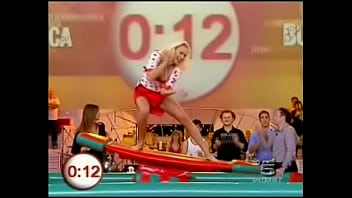 A blonde italian celeb is doing some indoor surfing for a tv show in a miniskirt it was always clear there was be the inevitable upskirt oops fun