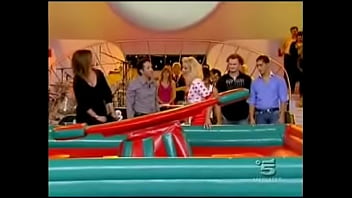 A blonde italian celeb is doing some indoor surfing for a tv show in a miniskirt it was always clear there was be the inevitable upskirt oops fun