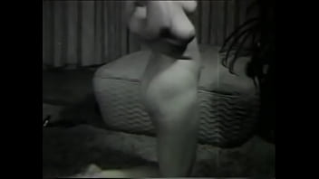 Playful babe takes off her clothes at home and shows her ass