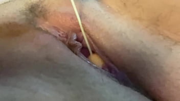 Redhead babe plays with big tits and with pussy with balls