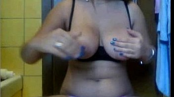 Brunette teen shows her tits and puts a finger in her pussy