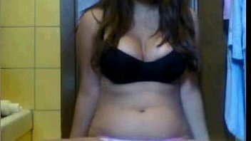 Brunette teen shows her tits and puts a finger in her pussy