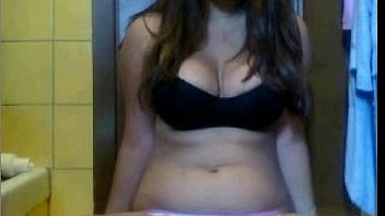 Brunette teen shows her tits and puts a finger in her pussy