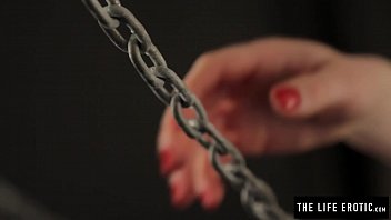 Chained beauty brings herself to a hard orgasm