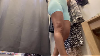 A woman with big boobs in a public locker room