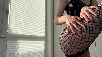 Perfect ass latex tease in fishnets and boots