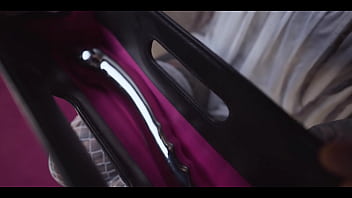 Tattoo slut sinks a thick metal toy deep into her hole