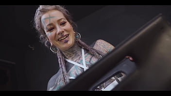 Tattoo slut sinks a thick metal toy deep into her hole