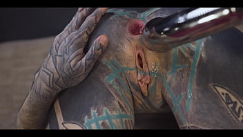 Tattoo slut sinks a thick metal toy deep into her hole